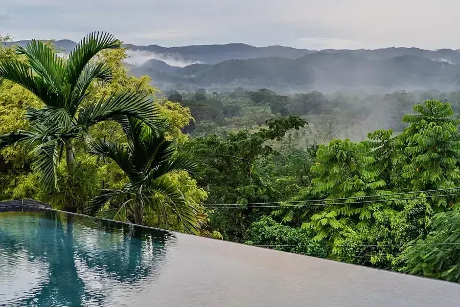 The saltwater infinity pool at Good Hope with the mountains behind