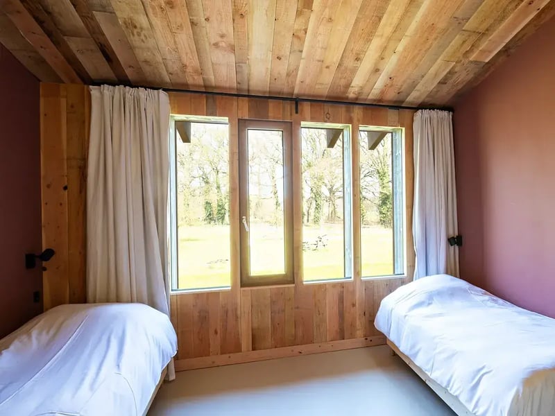 Twin beds in a lodge at The Place To Be