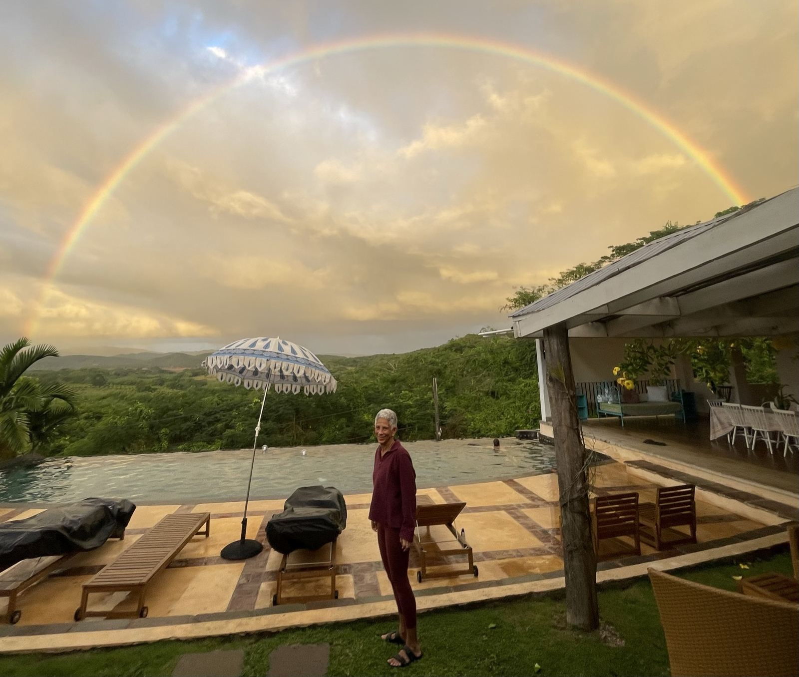Dr. Dingle Spence at Good Hope, Jamaica, under a rainbow